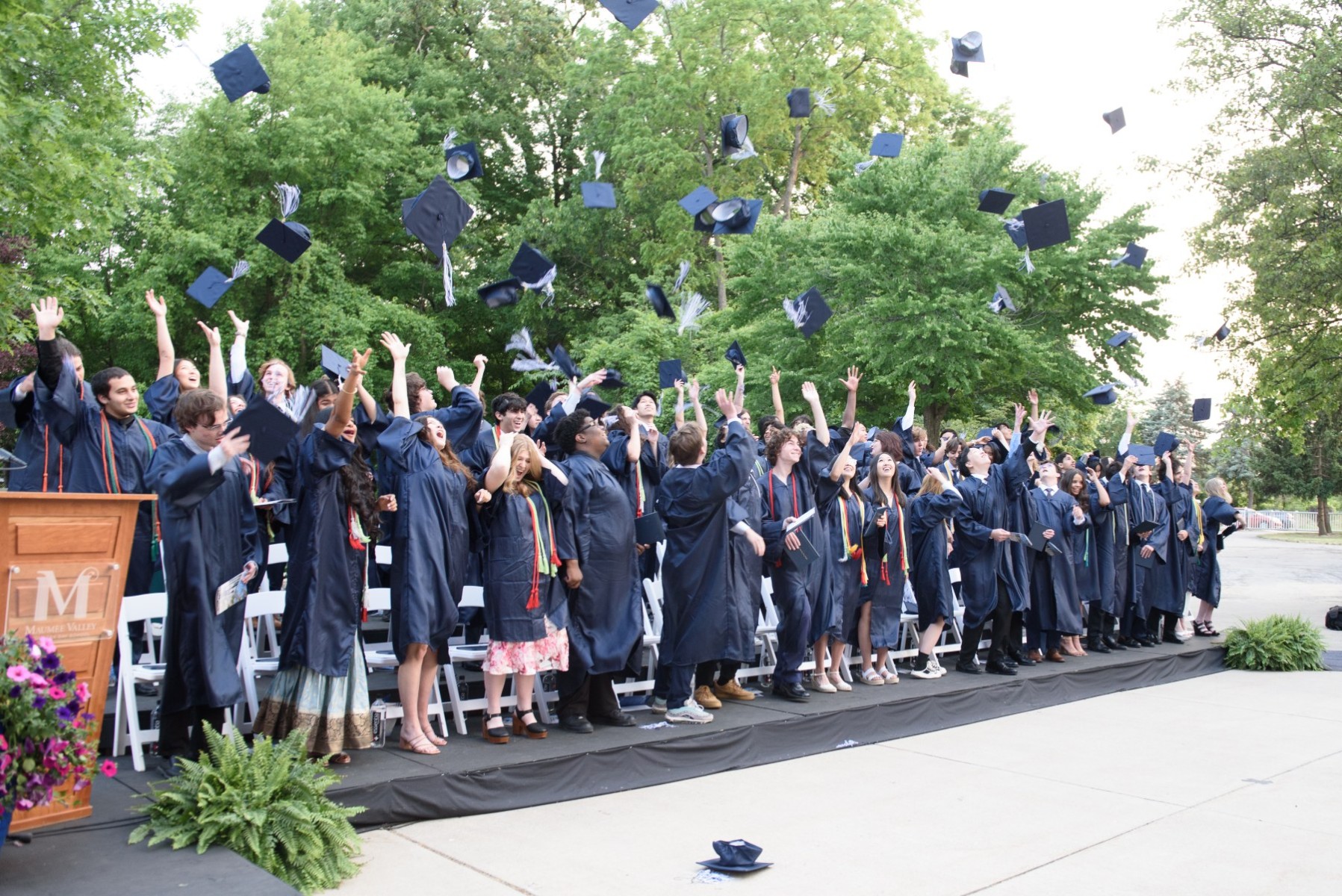 maumee valley student grads throwing up hats